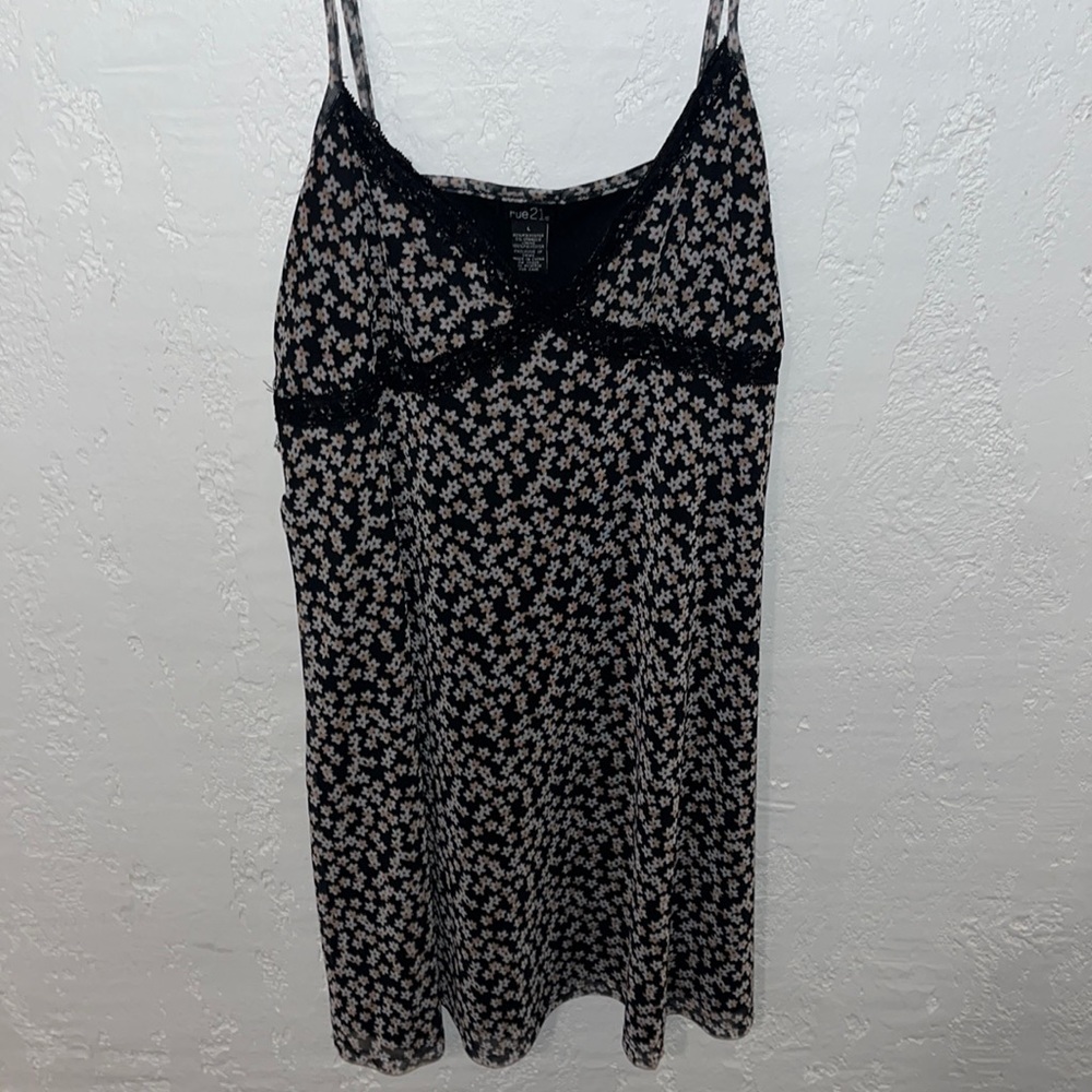 Mini slip dress. Black with lace detail and floral detail.